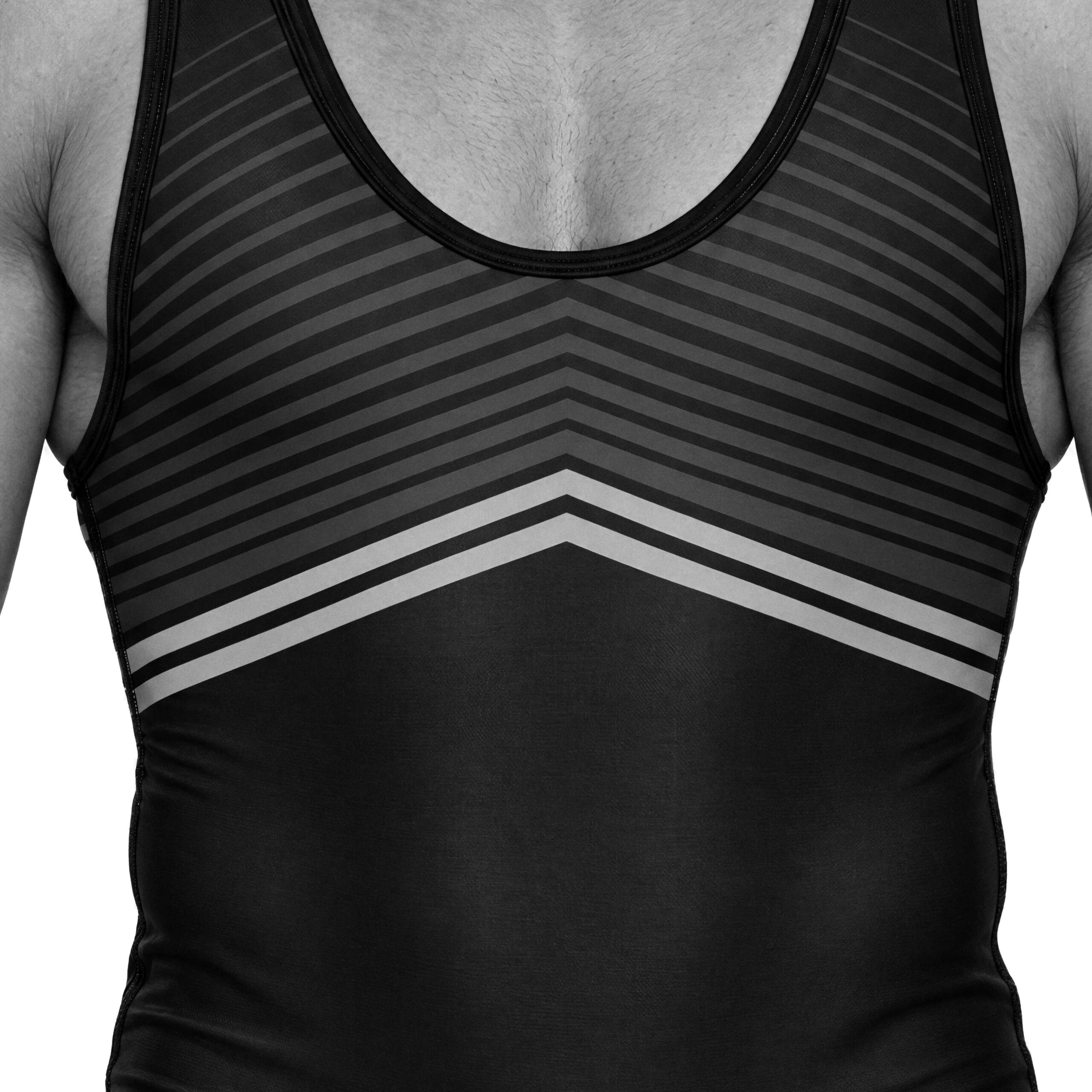 A wrestler in a black singlet with chevron stripes across the chest
