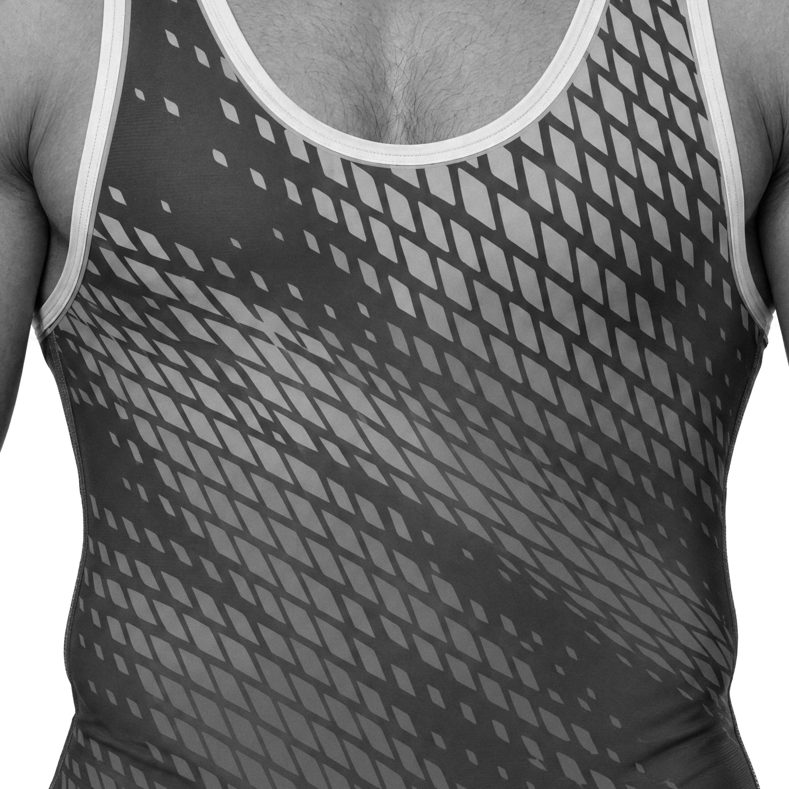 A wrestler in a singlet printed with a diagonal field of diamonds